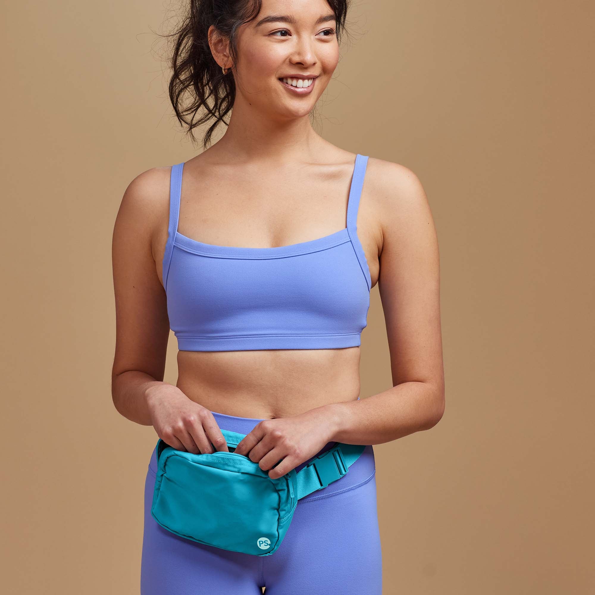 Person wearing the POPSUGAR Waist Pack around the waist